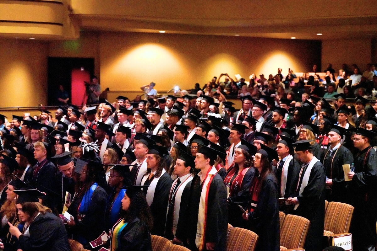 Photo of Maryville College graduates of 2024 at Commencement in the Clayton Center for the Arts auditorium