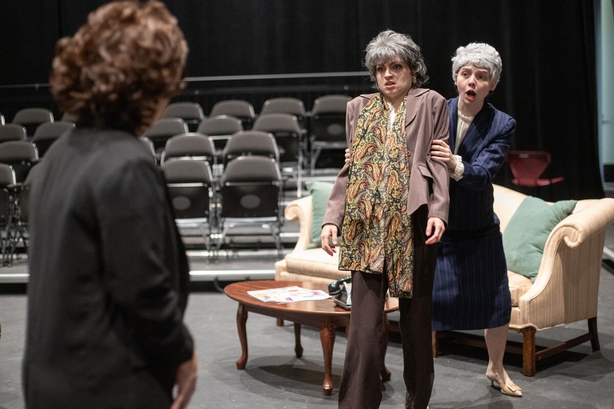 Photo of three cast members rehearsing a scene from the Maryville College Theatre production of "Steel Magnolias"