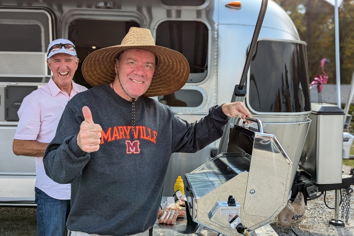 Photo of a guy at a grill at MC Homecoming 2024