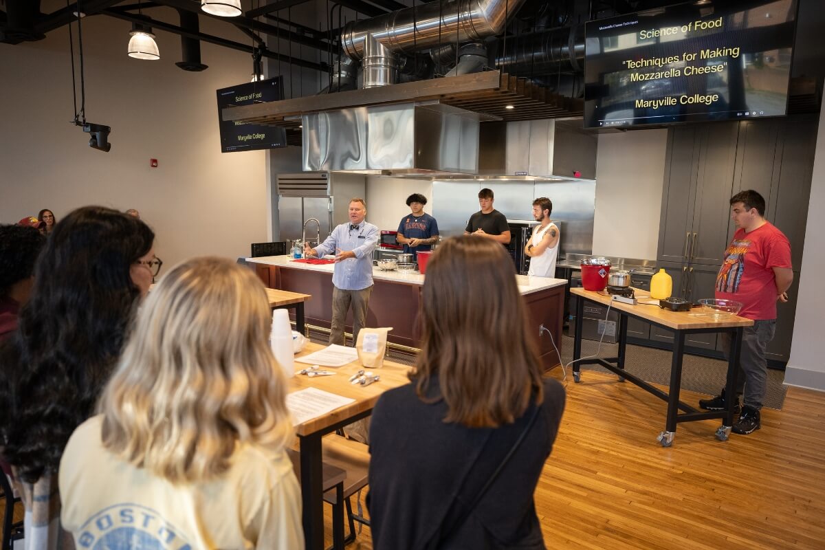 Photo of Dr. Drew Crain teaching a class in the Maryville College Downtown Center