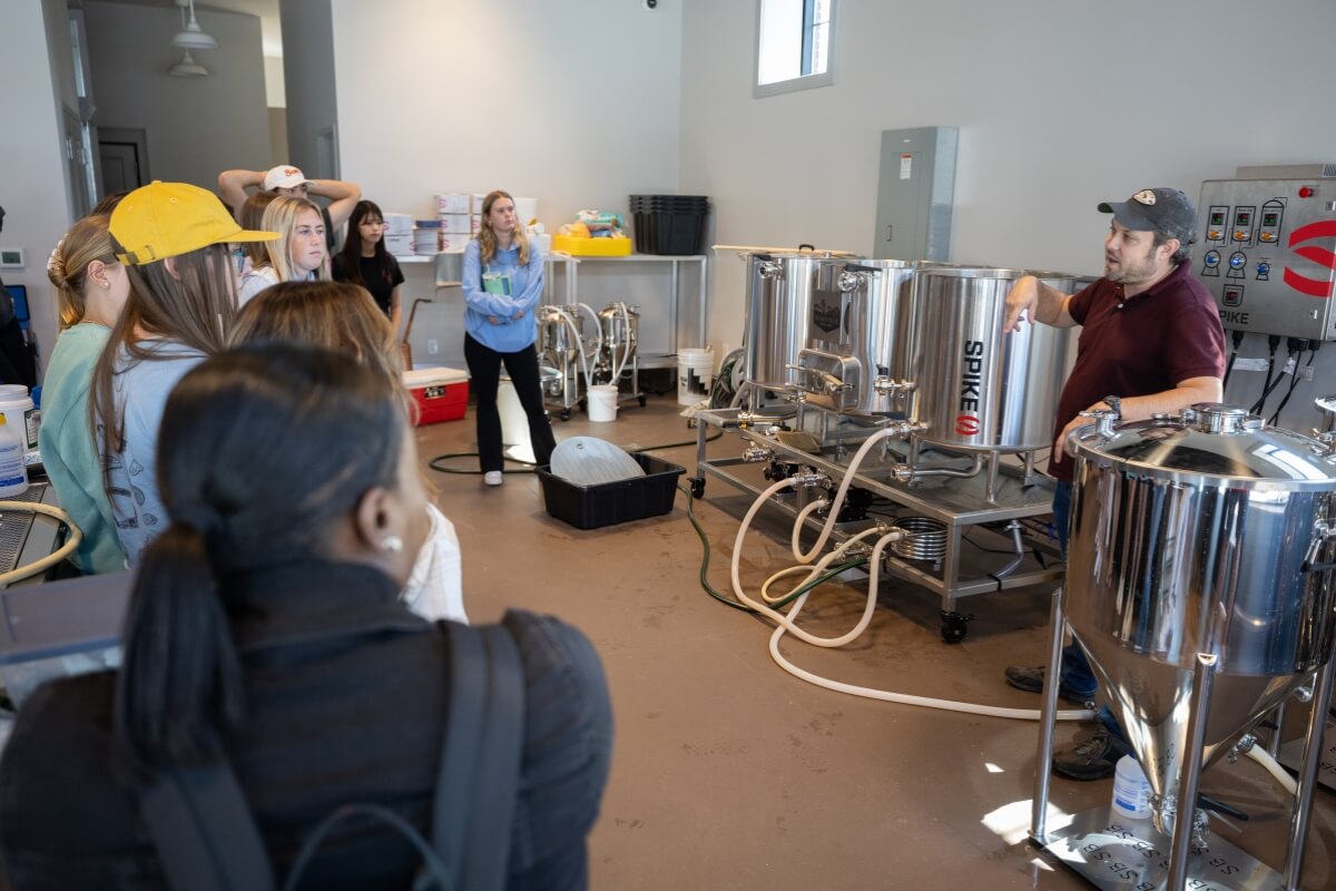 Photo of Dr. Nathan Duncan teaching a brewing course at the MC Downtown Center
