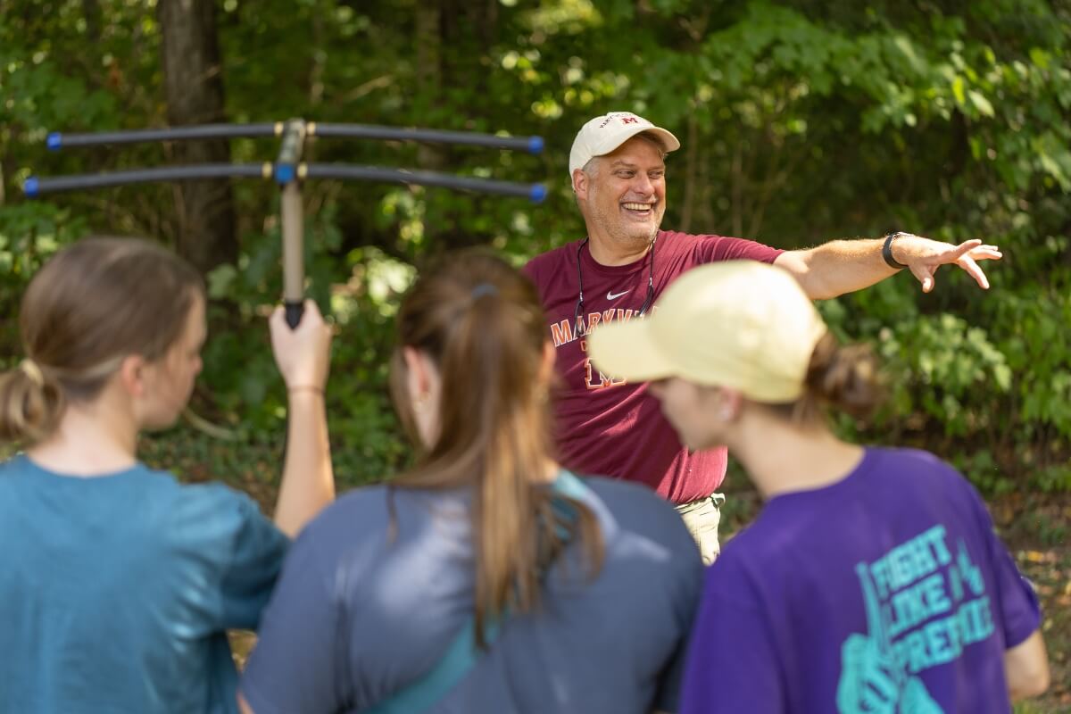 Photo of Dr. Dave Unger leading a class to do some turtle research in the Maryville College Woods