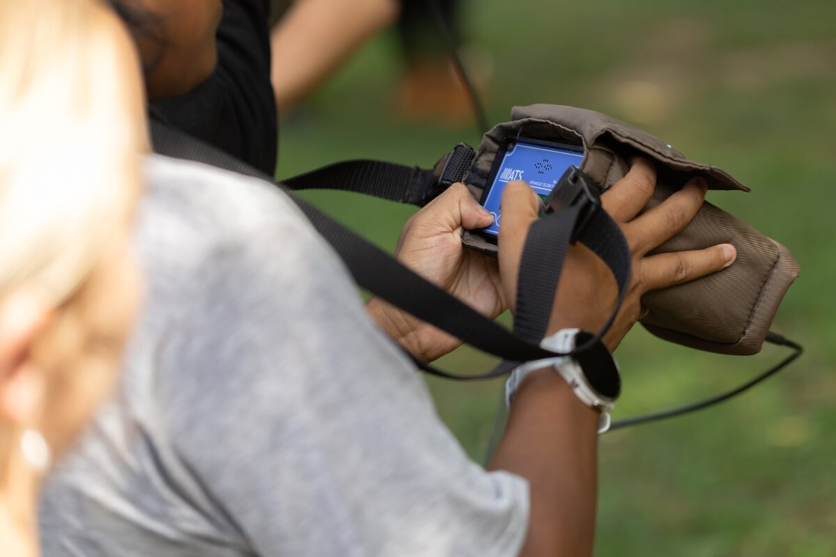 Photo of student holding a telemetry reader