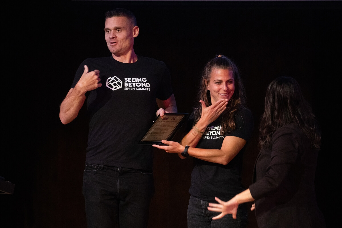 Photo of deaf mountaineers on stage
