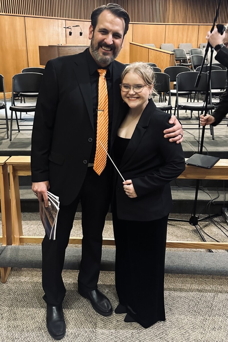 Photo of Elaine Wilson smiling beside Chris Clift