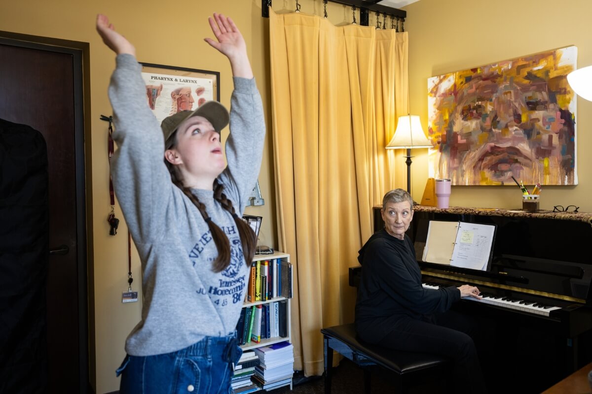 Photo of Dana Patterson '26 stretching prior to an exercise with Dr. Alicia Massie Legg