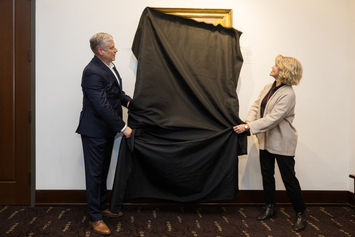 Photo of Bryan Coker and Lindy Bruggink unveiling a photo