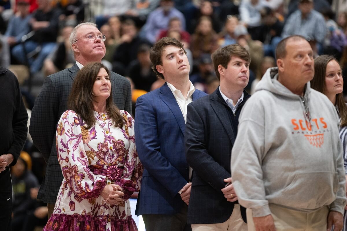 Photo of Scott Fletcher and his family at Maryville College watching a Stan Ballard dedication video