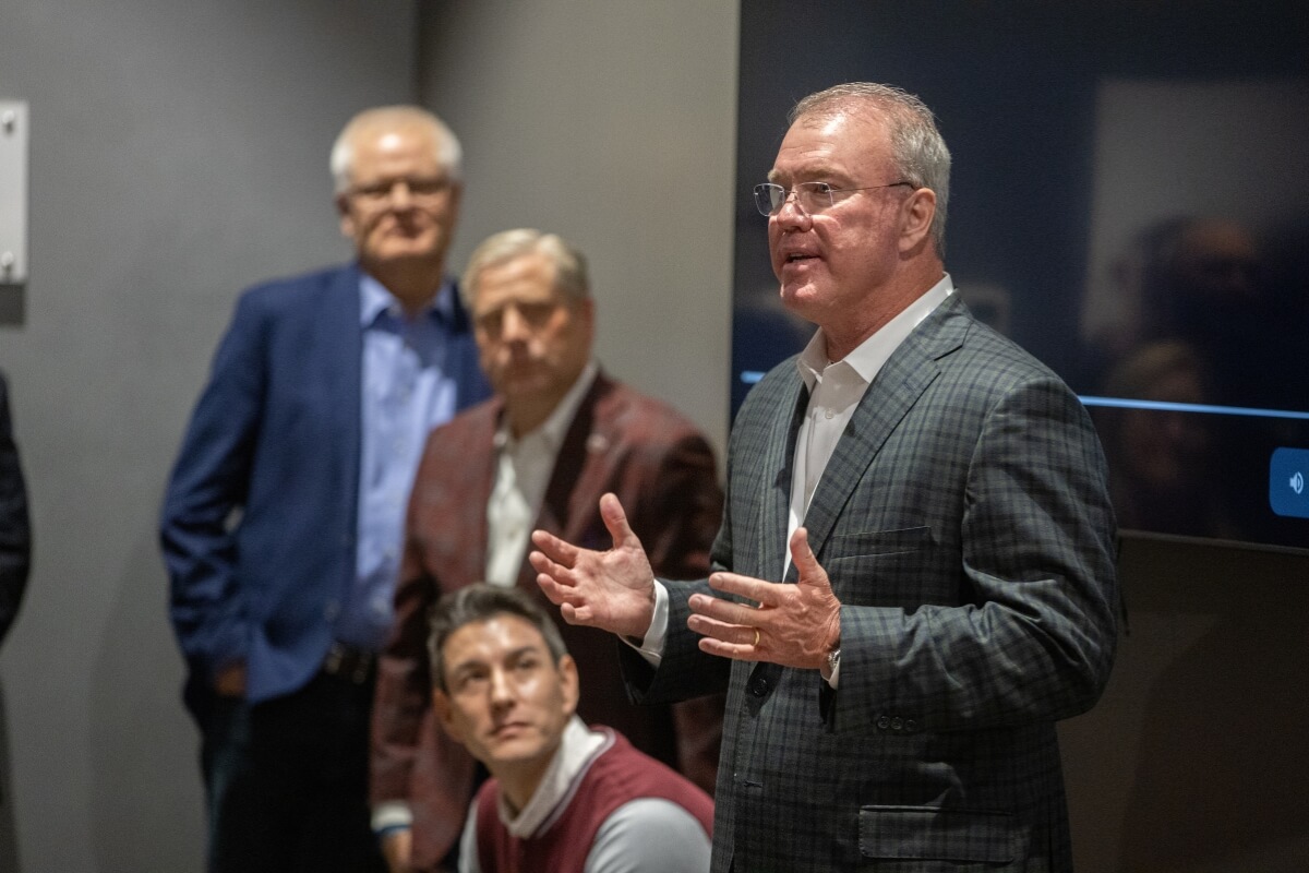 Photo of Scott Fletcher '89 explaining how the Ballard Practice Facility came to life under the stewardship of Maryville College's Randy Lambert '76