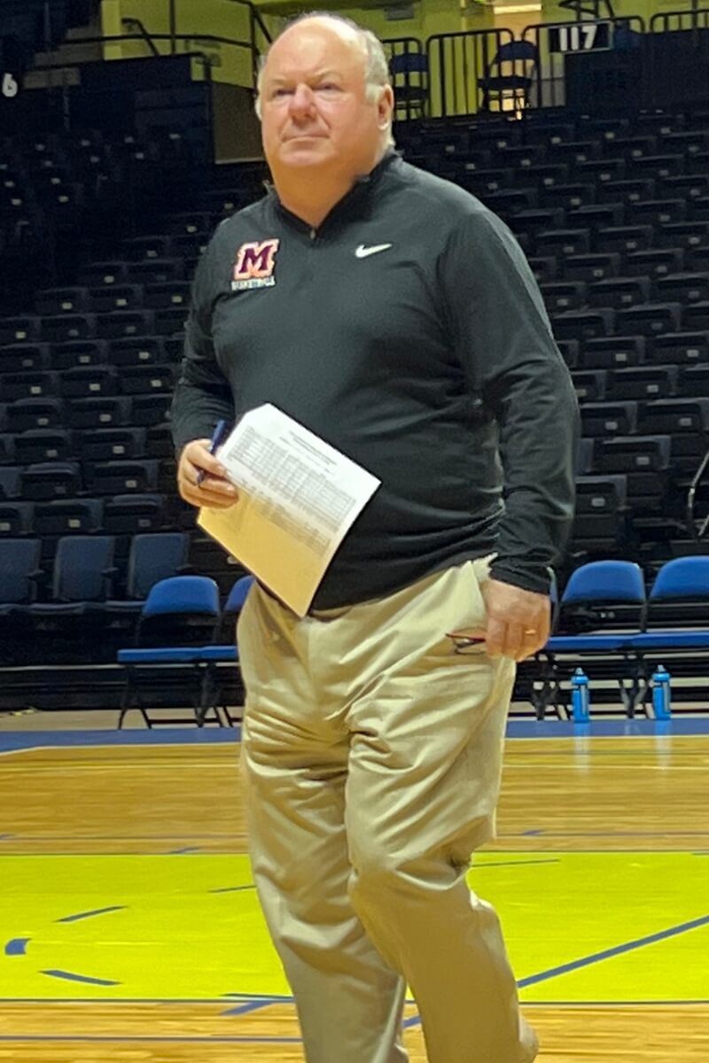 Photo of John Painter on the basketball court at the Cooper Athletic Center