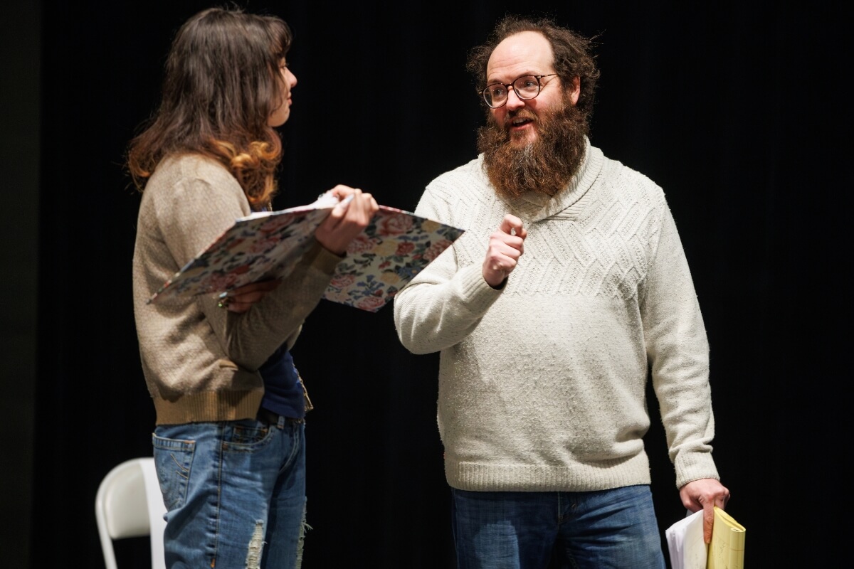 Photo of Andy Vaught, smiling as he talks with a student