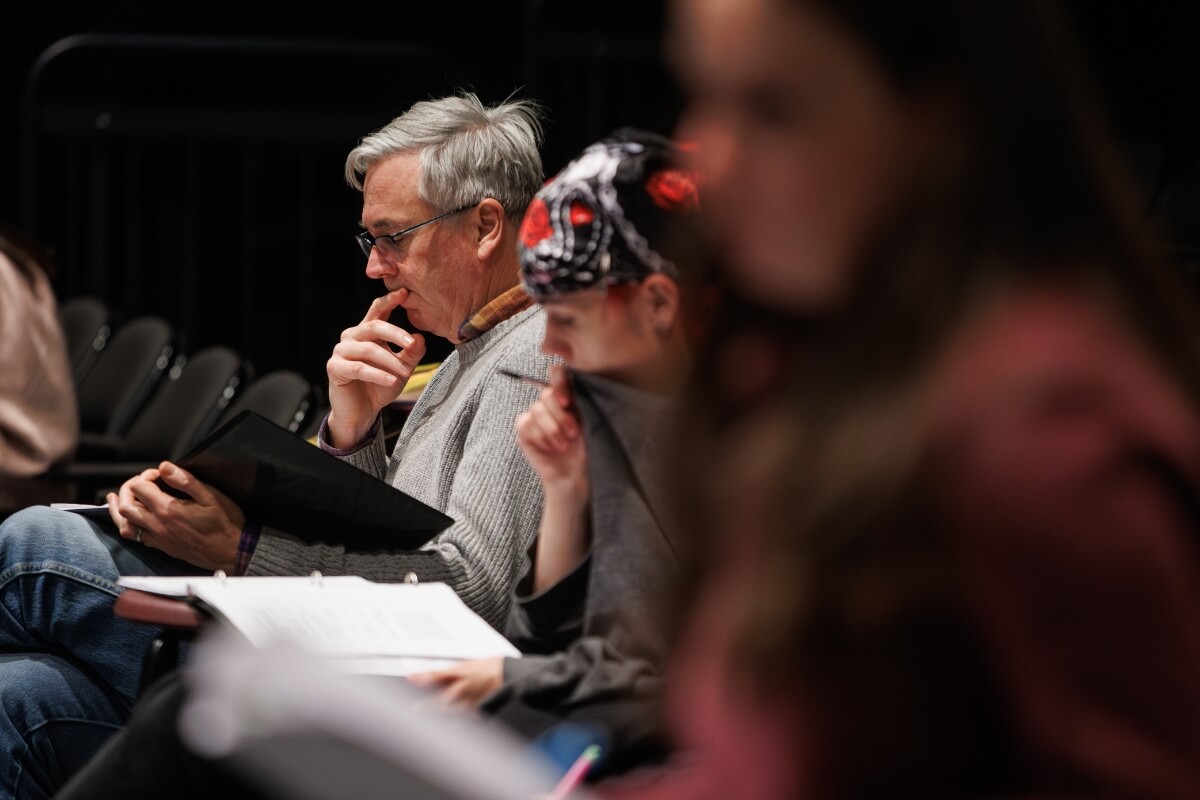 Photo of actors in Maryville College Theatre's "Romeo and Juliet" reading the script