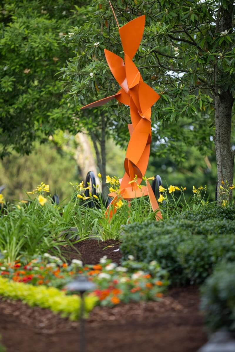 Photo of the treble clef sculpture in the Clayton Center memorial garden