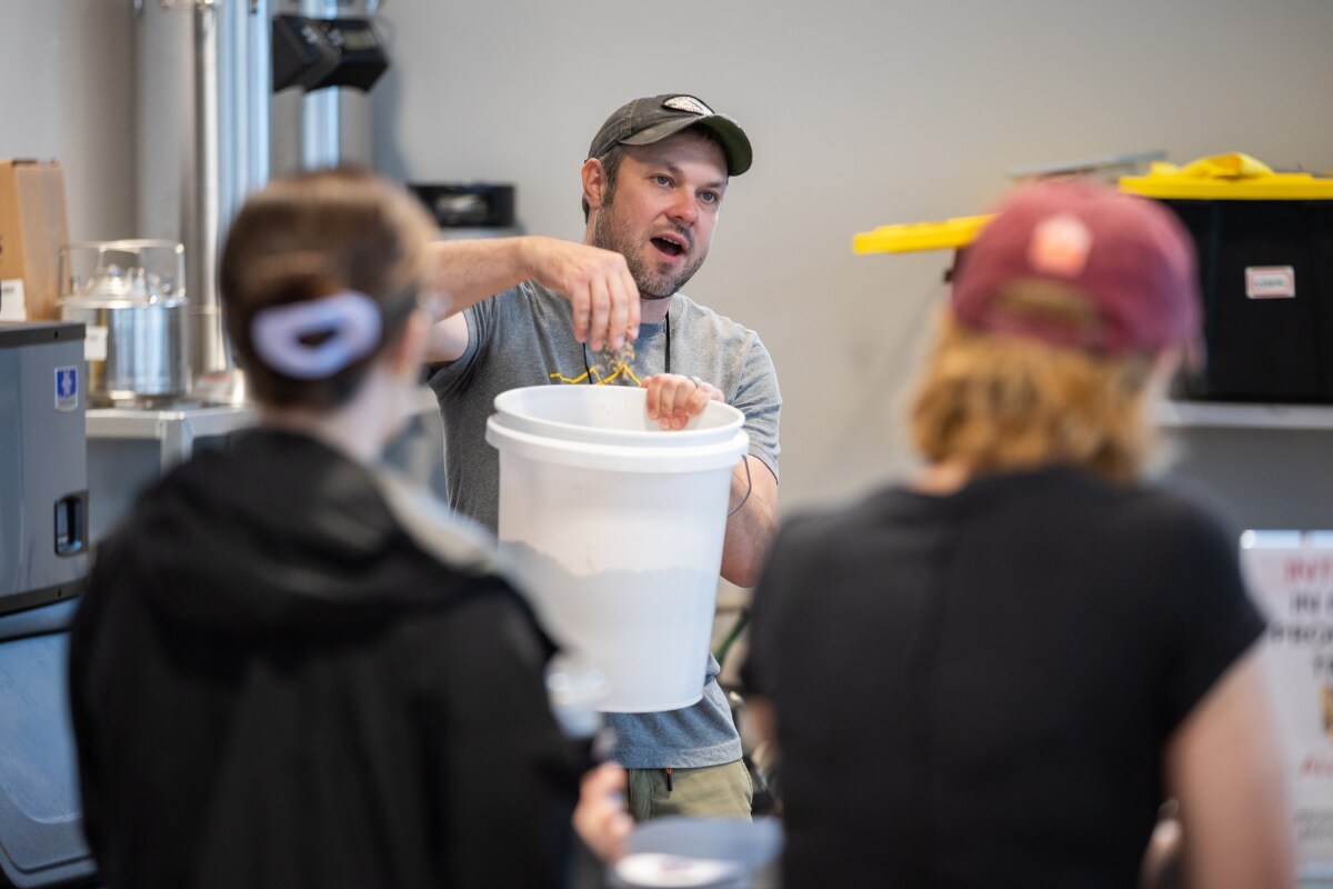 Photo of Dr. Nathan Duncan explaining the brewing process