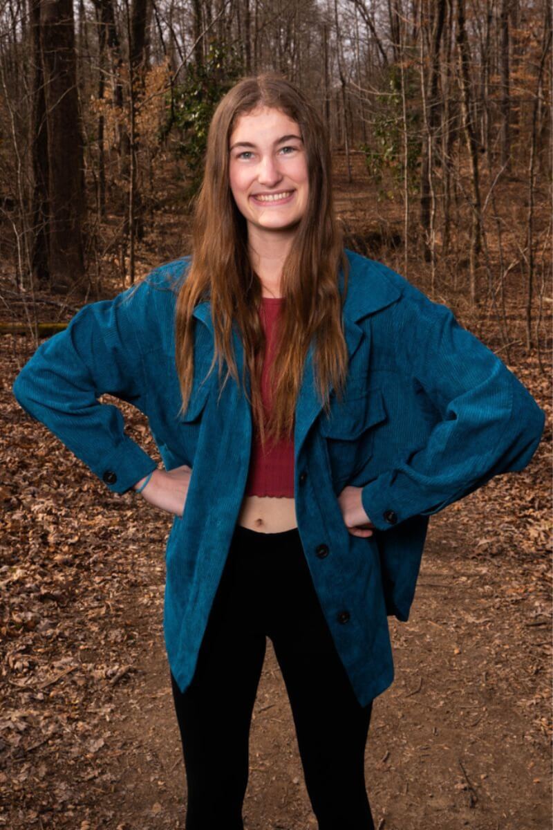 Photo of Gabbie Noonan '25 standing and smiling with hands on her hips
