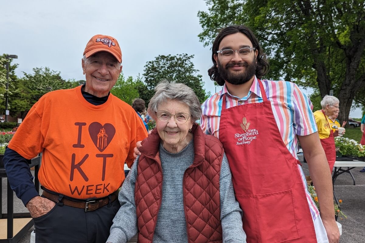 Photo of three smiling Maryville College alumni doing service work for KT Global 2024