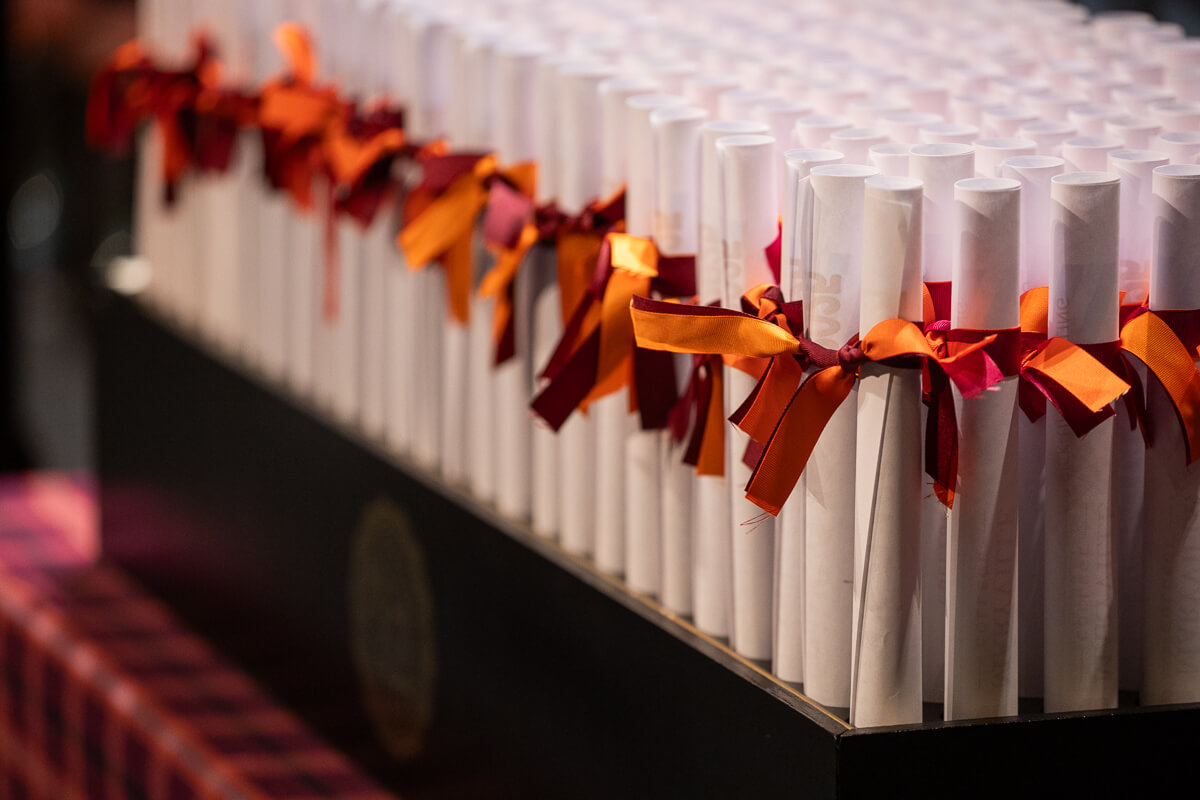 Photo of diplomas rolled up and ready for distribution