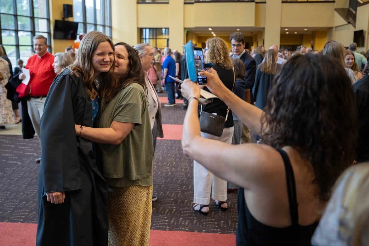 Photo of two people having their picture taken.