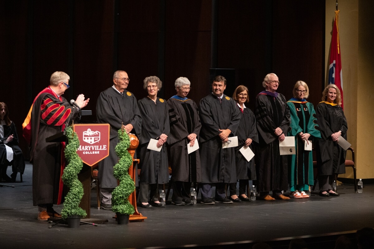 Photo of Dr. Bryan Coker recognizing the Maryville College Board of Directors at the Maryville College Baccalaureate 2025 ceremony