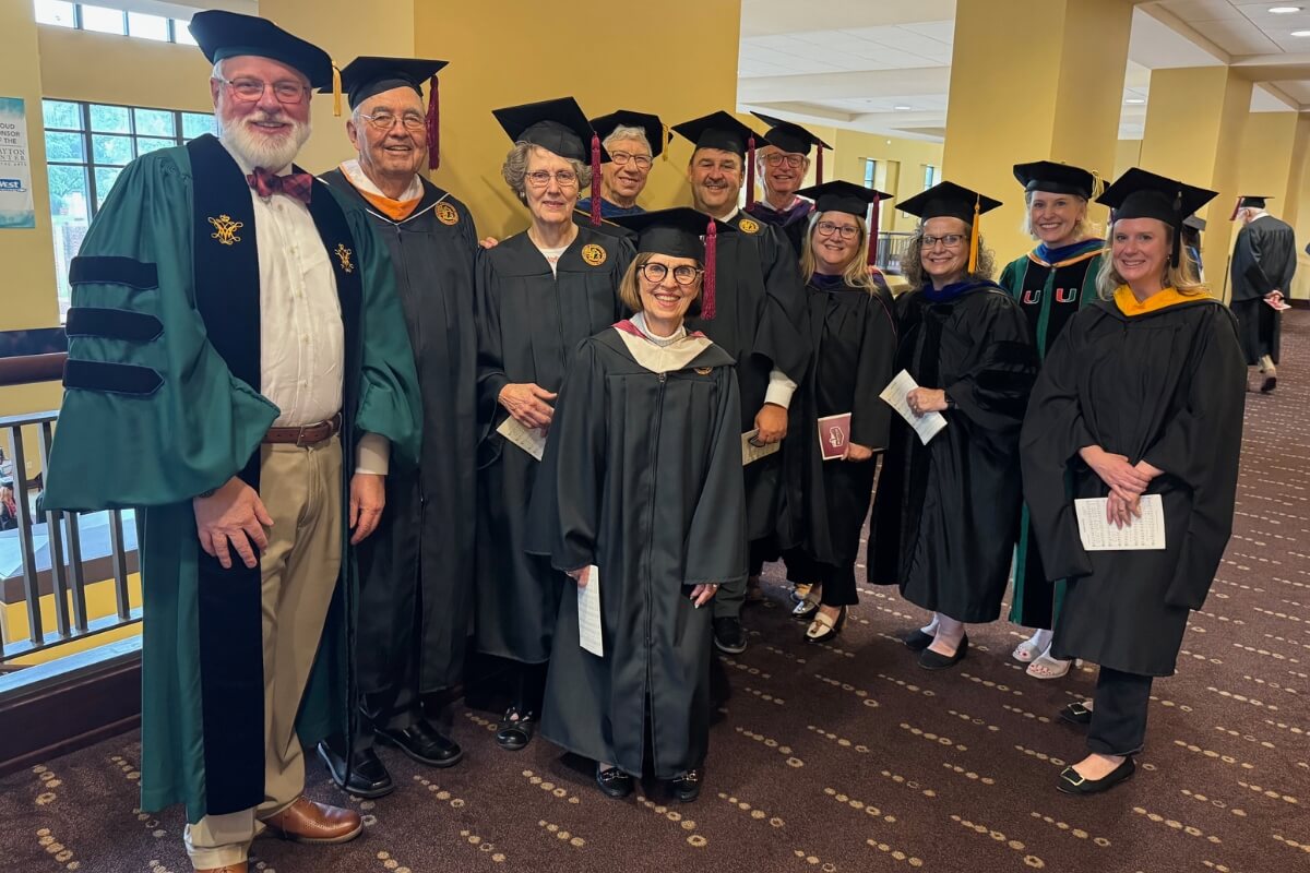 Photo of the Maryville College Board of Directors smiling and posing during Maryville College Commencement 2025