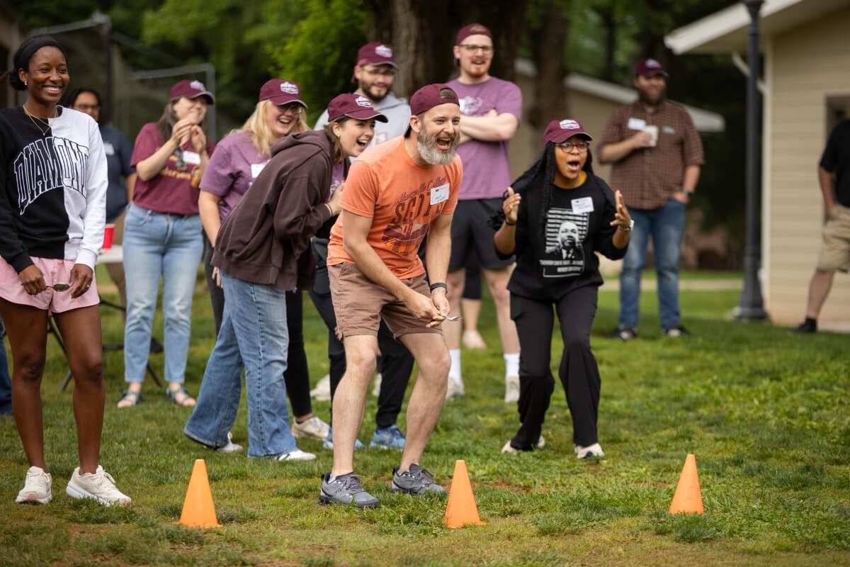 Photo of a crowd of Maryville College staffers cheering one another on during Maryville College Staff Day