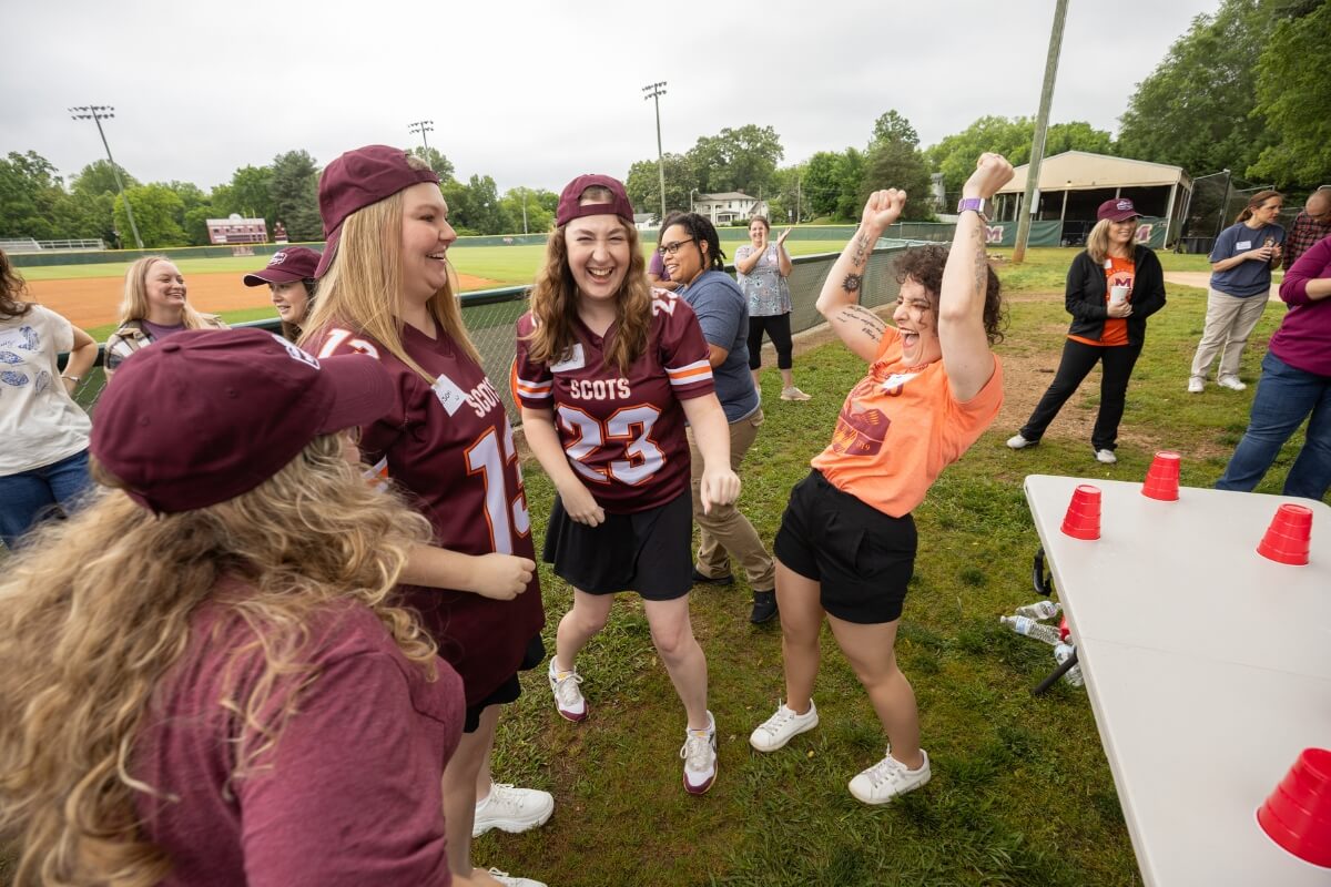 Photo of celebrating staff members after winning a game