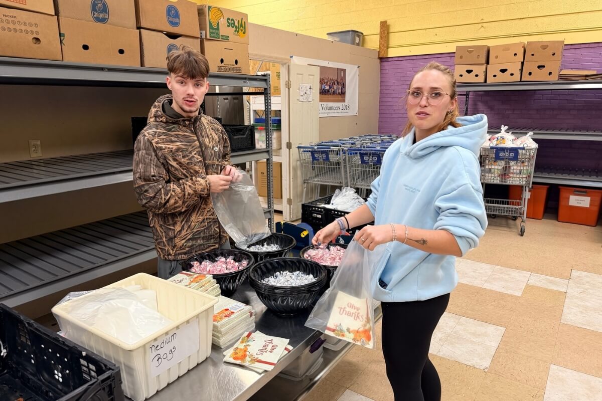 Photo of two Maryville College students doing community service work
