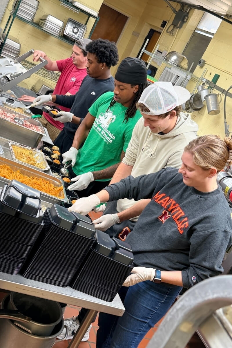 Photo of Maryville College students preparing mobile meals for Blount County residents