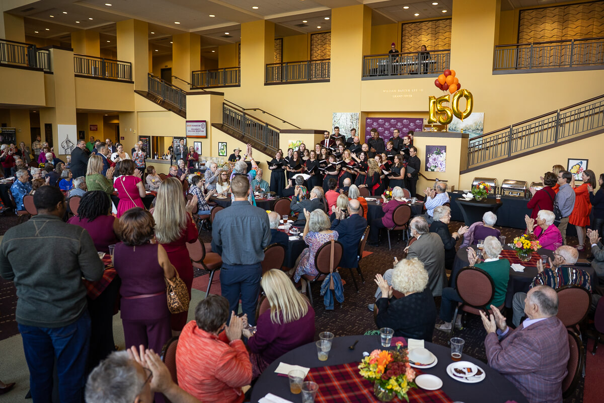 Photo of a crowd of people in the foyer of the Clayton Center for the Arts