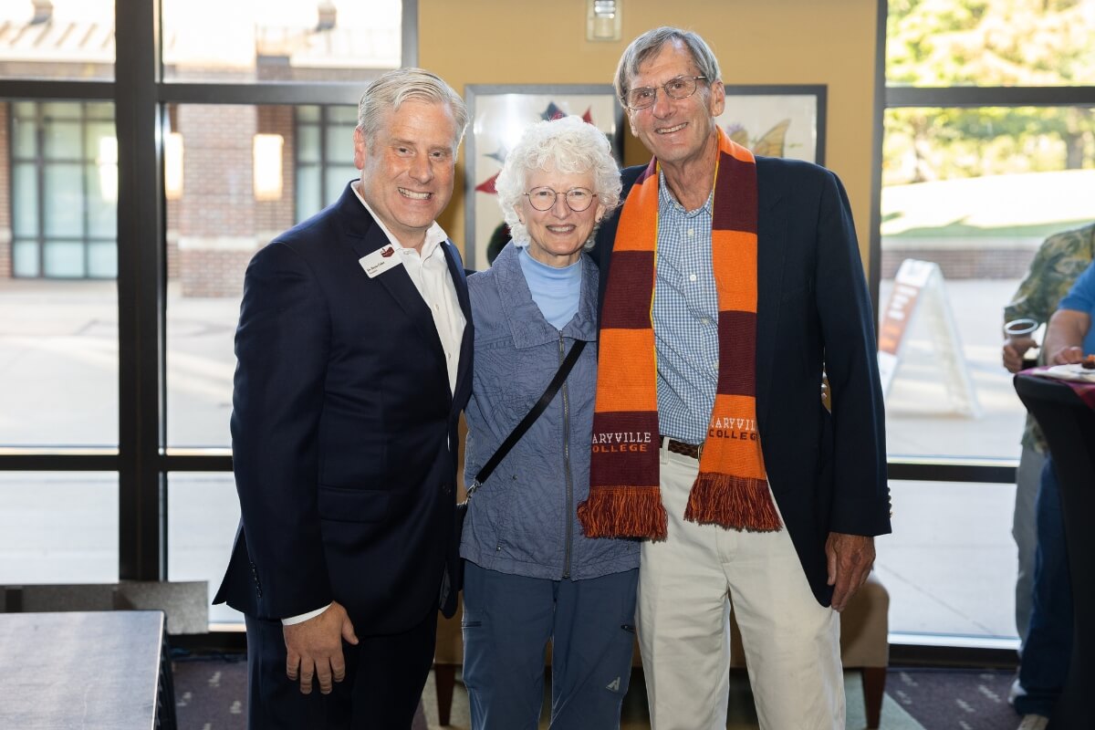 Photo of Dr. Bryan Coker smiling beside two alums whose financial gifts to Maryville College total $500,000