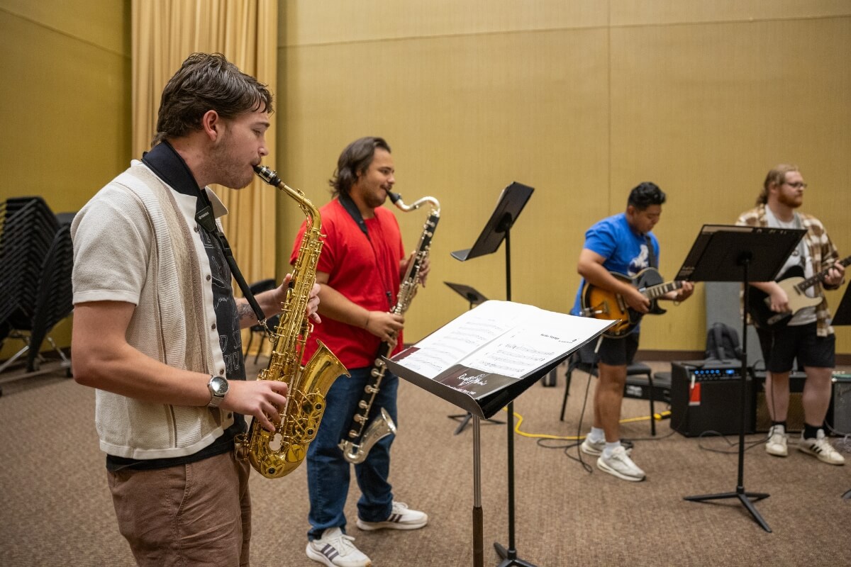 Photo of members of the Maryville College Jazz Band standing and playing instruments