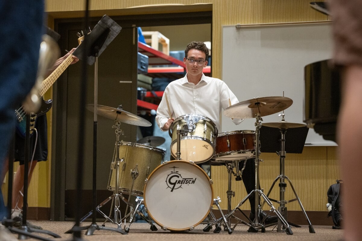 Photo of Michael Howard '28 playing drums