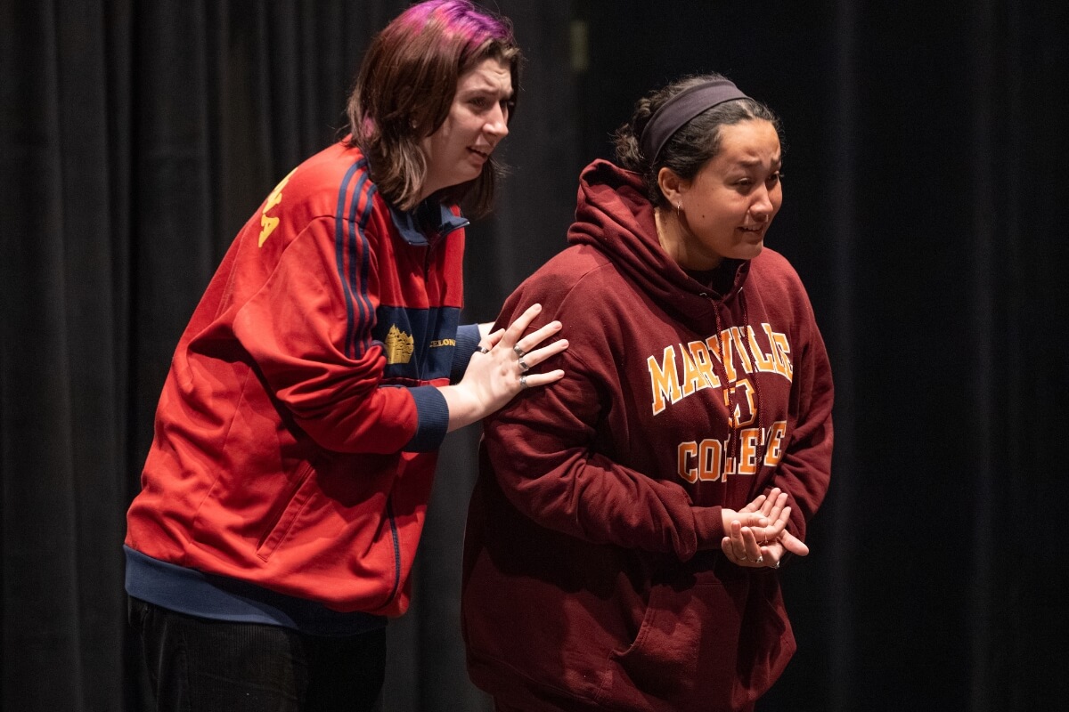 Photo of two Maryville College actresses looking angst and stressed