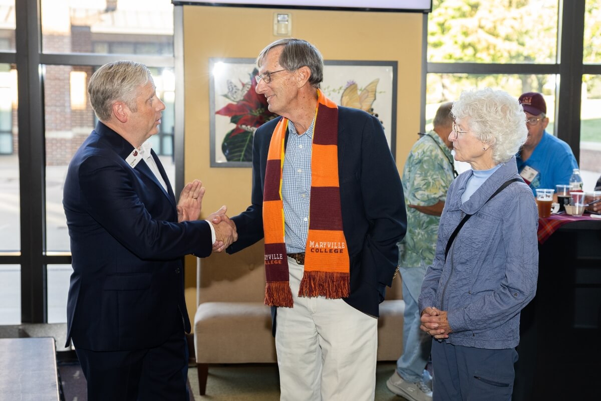 Photo of Dr. Coker thanking Maryville College alums Bill and Jan Welton Postler for their gifts