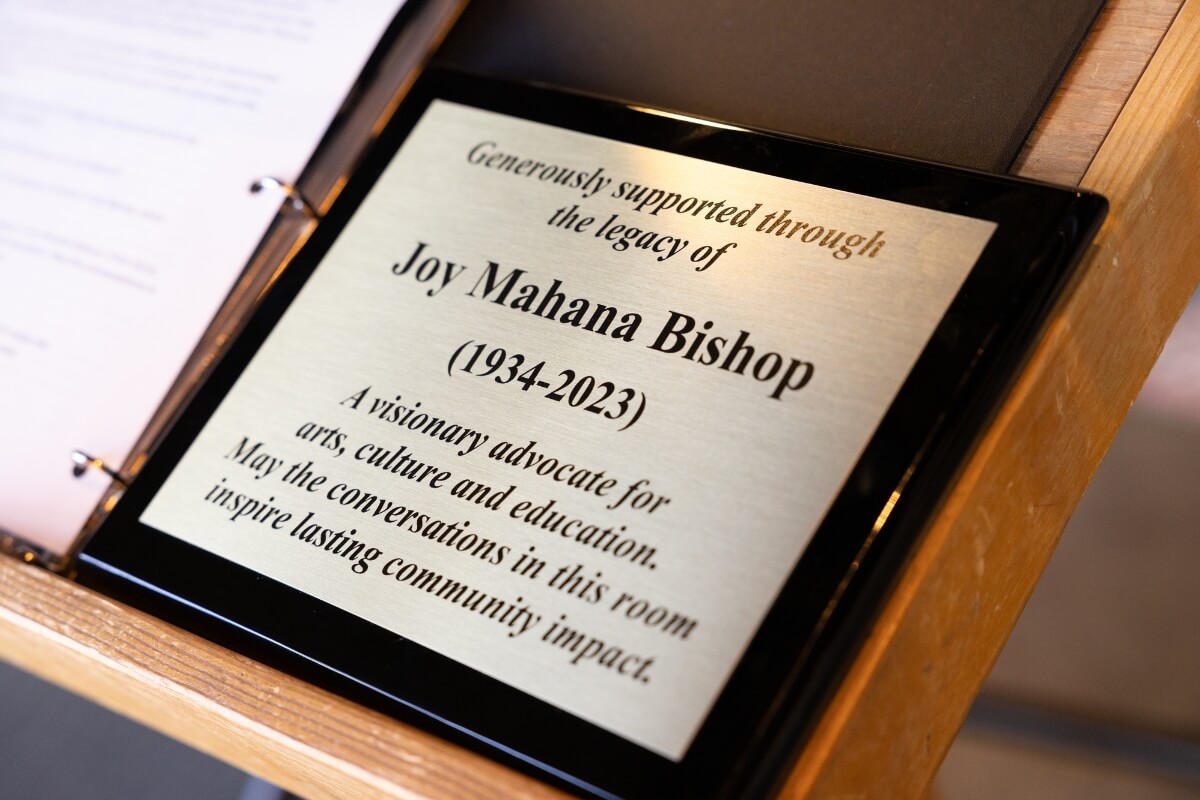 Photo of the plaque dedicating space in the Clayton Center to the late Joy Bishop