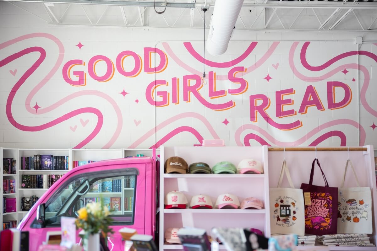 Photo of a wall sign that says "Good Girls Read"