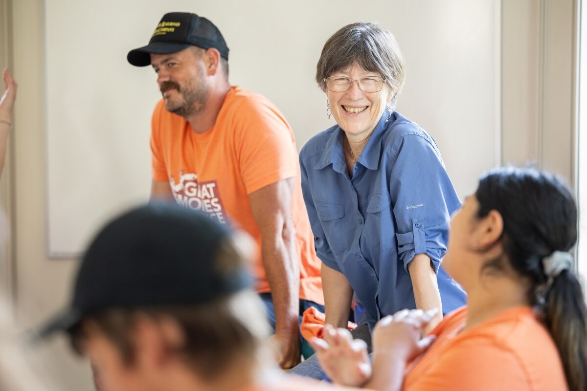 Photo of Kathy Ansley and Dr. Andrew Gunnoe talking with Great Smokies Experience participants