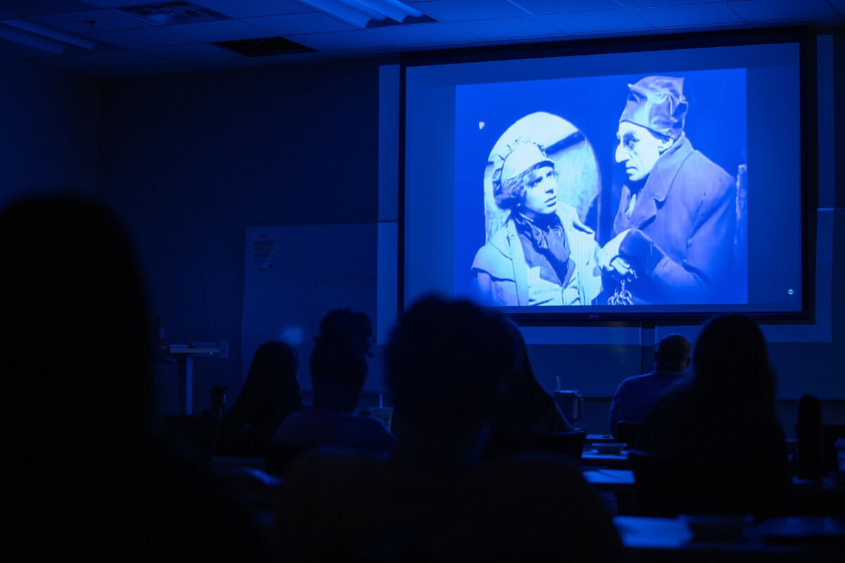Photo of two characters on a screen