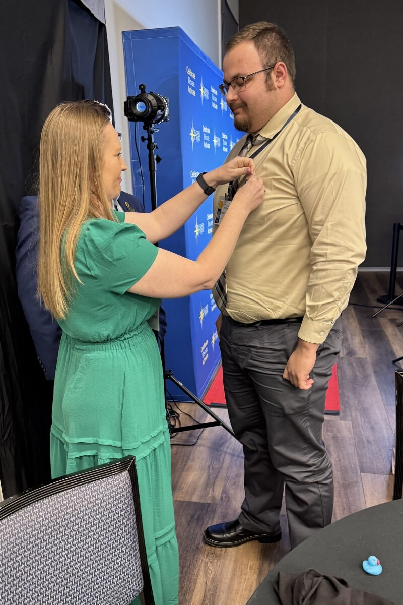 Photo of a student being pinned at a ceremony