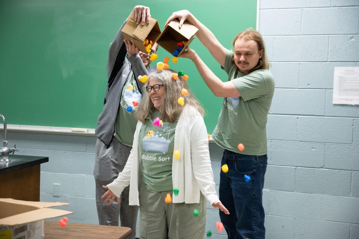 Photo of Maryville College students dumping rubber ducks on Barbara Johnson's head