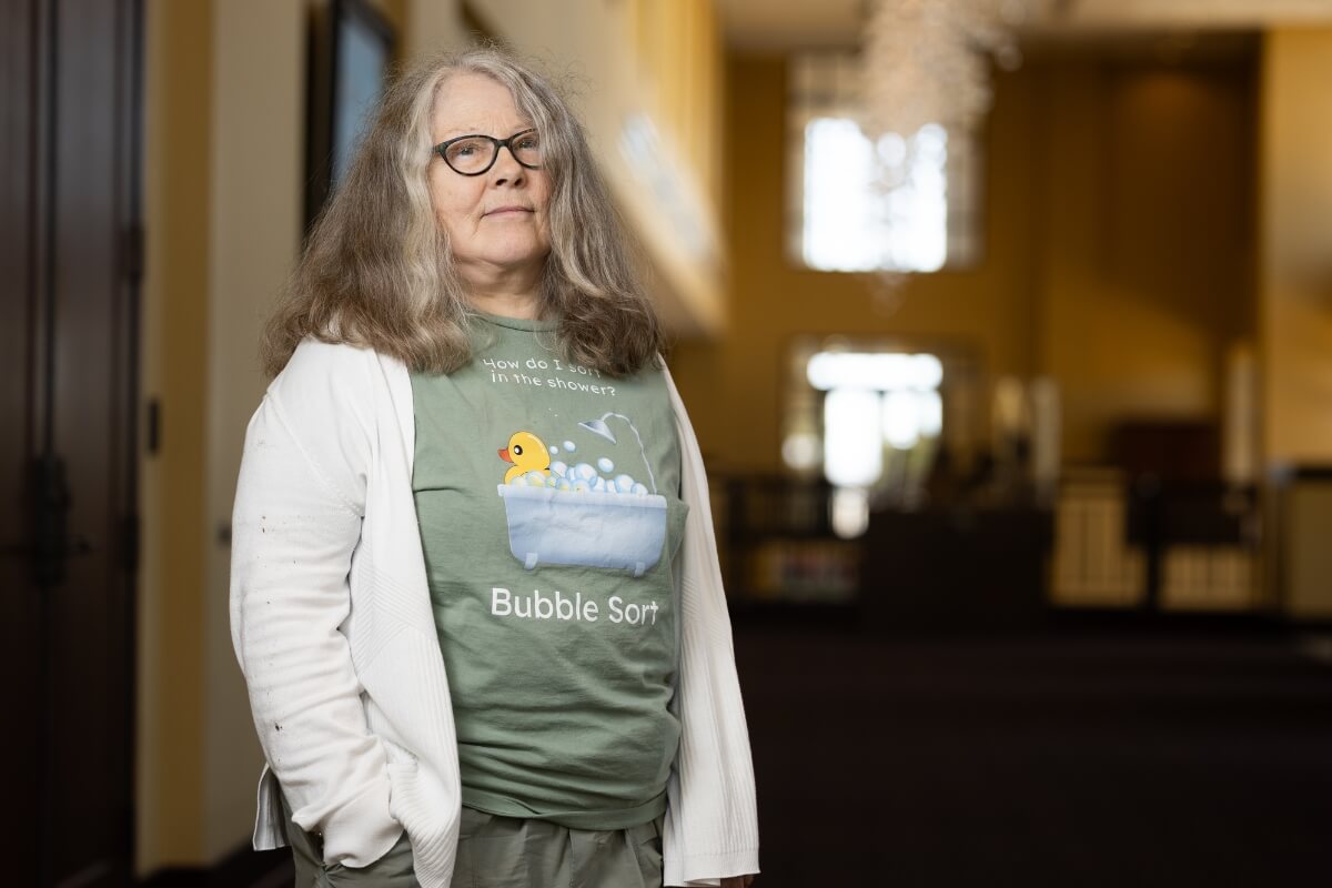 Photo of Dr. Barbara Johnson, standing inside the doorway of her Maryville College office