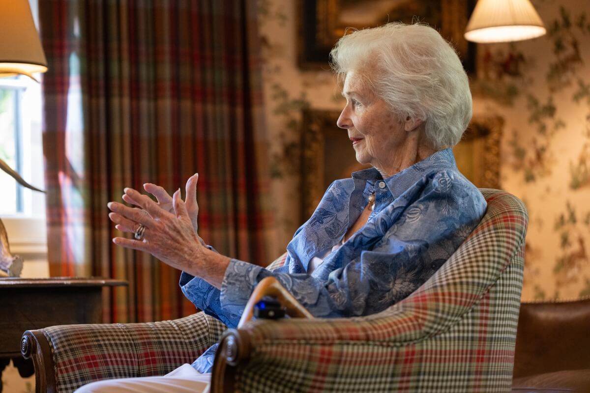 Photo of Natalie Haslam, telling a story in the RT Lodge parlor