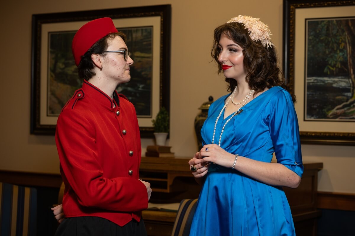 Photo of Reid Goad '28 and Eden Carnes '27, two Maryville College students acting in "Murder on the Orient Express."