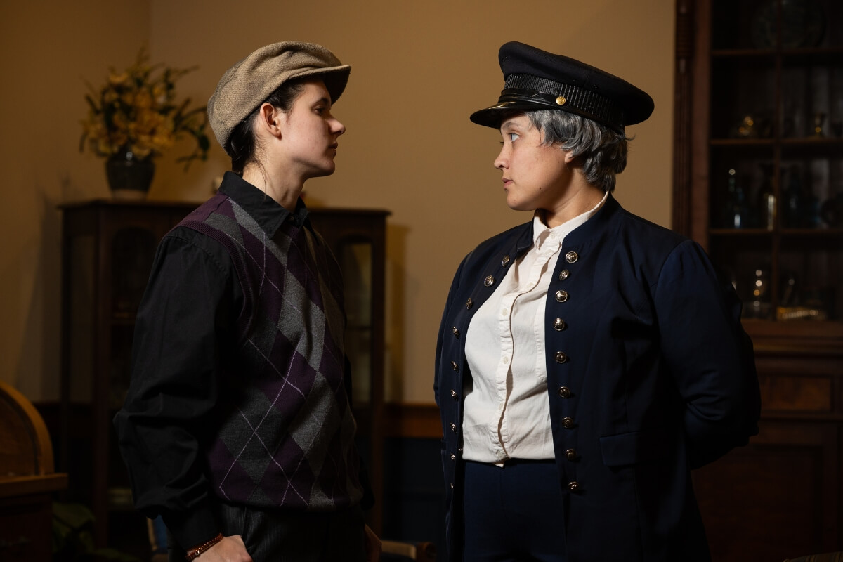 Photo of two Maryville College student actors staring at one another