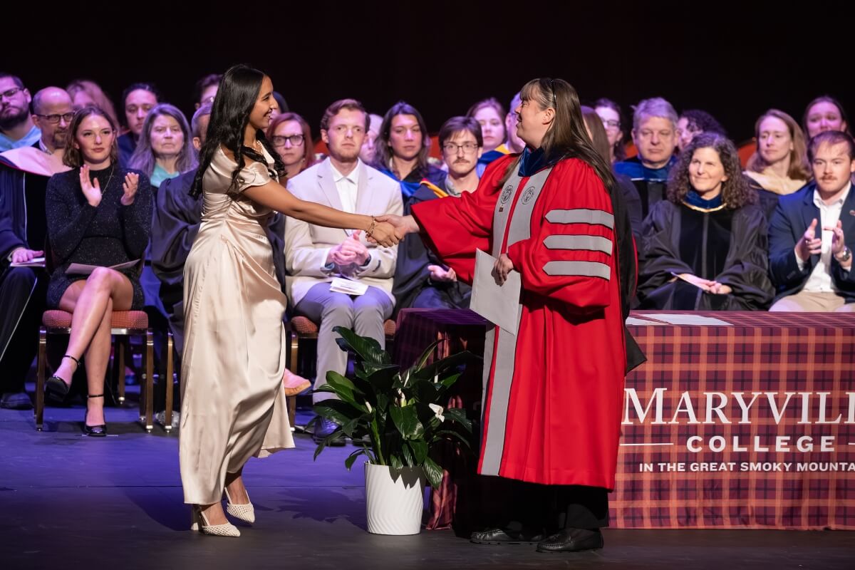 Photo of Rukhshona Isomova receiving an award