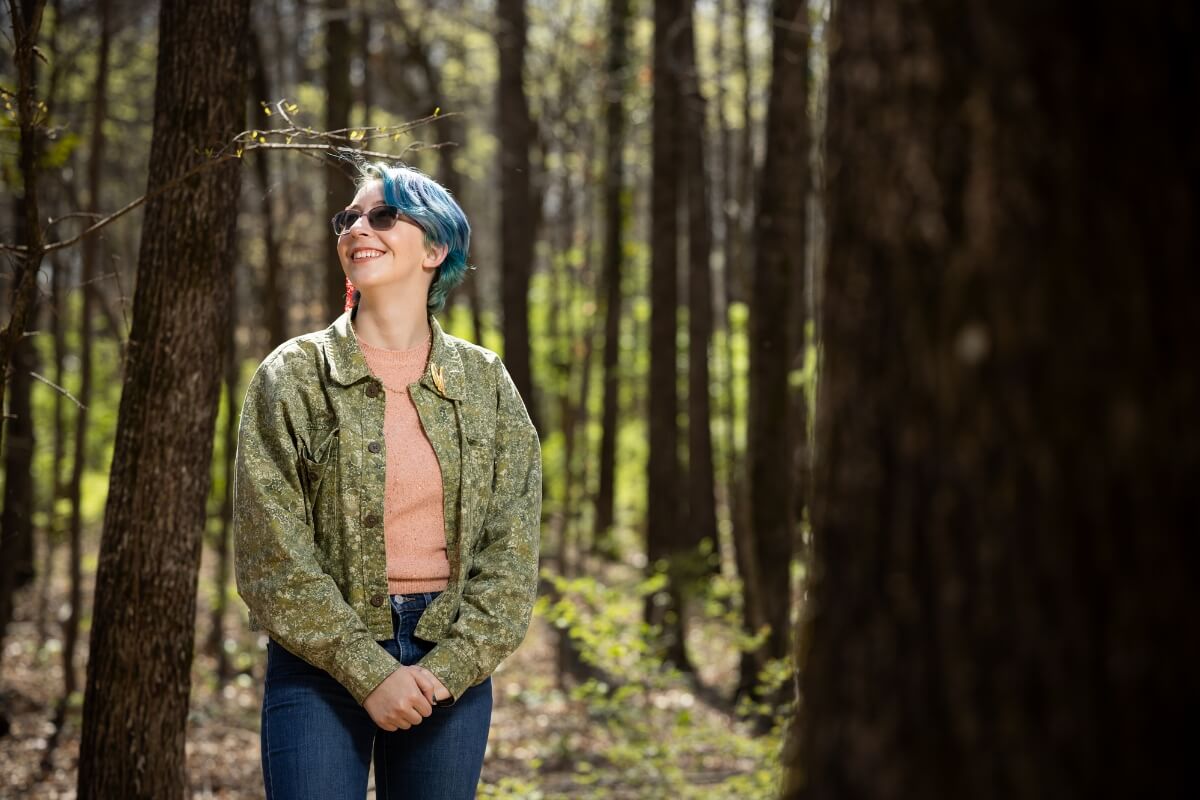 Photo of Gianna Mantegna '27 standing in the Maryville College Woods