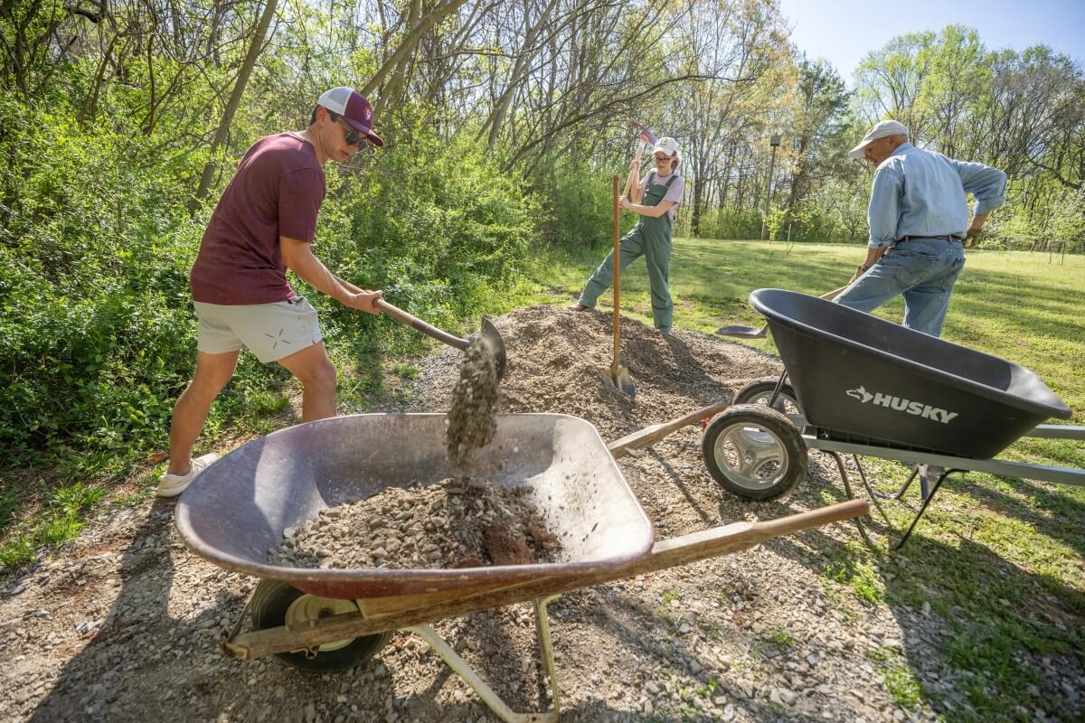 Photo of KT WEEKend workers outside in the Maryville College Woods. KT WEEKend is held during the month of KT Global