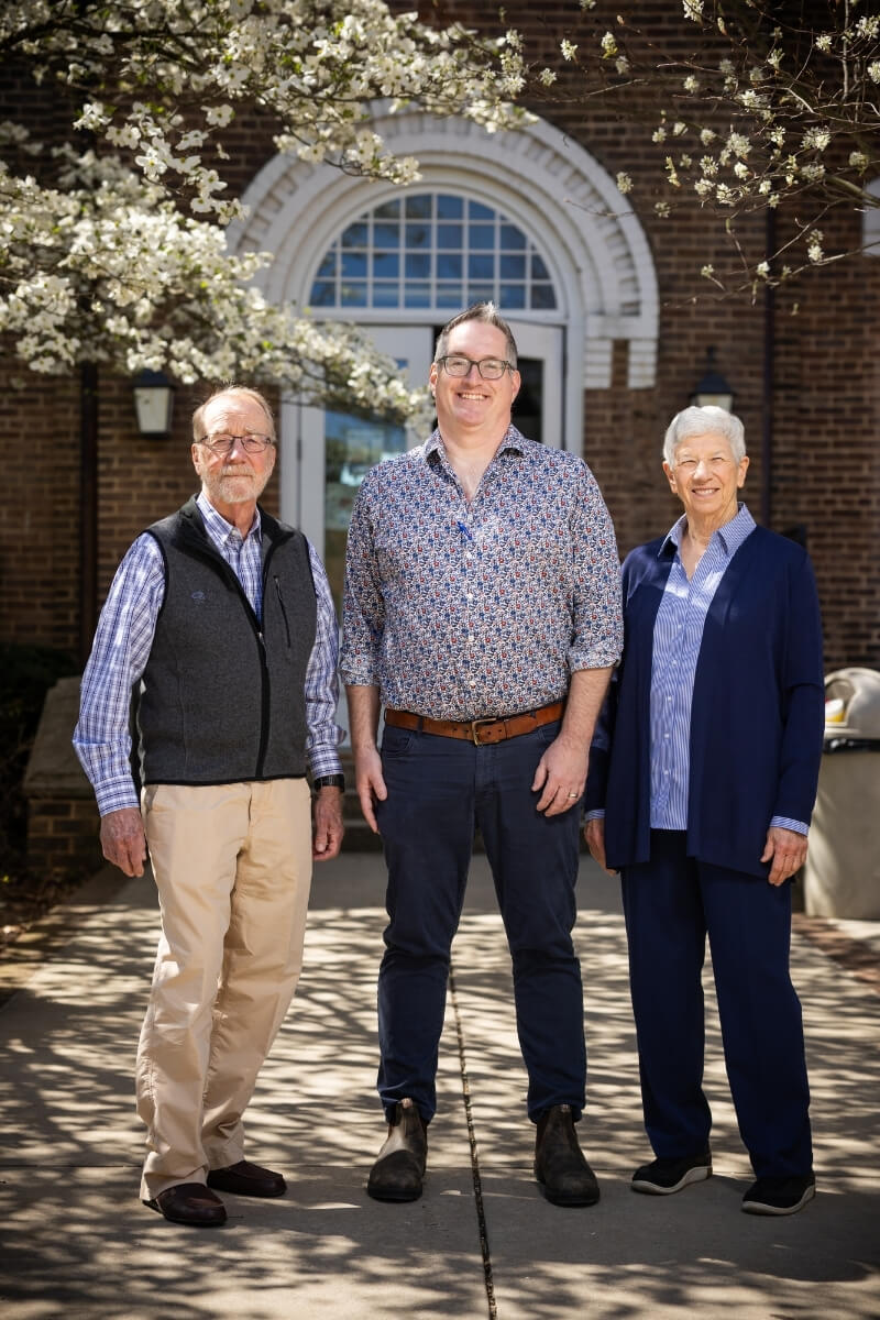 Photo of John and Peggy Cowan with Dr. Phillip Sherman in front of Anderson Hall