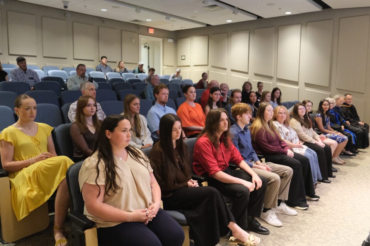 Photo of an auditorium full of students waiting to be inducted into one of Maryville College's honor societies