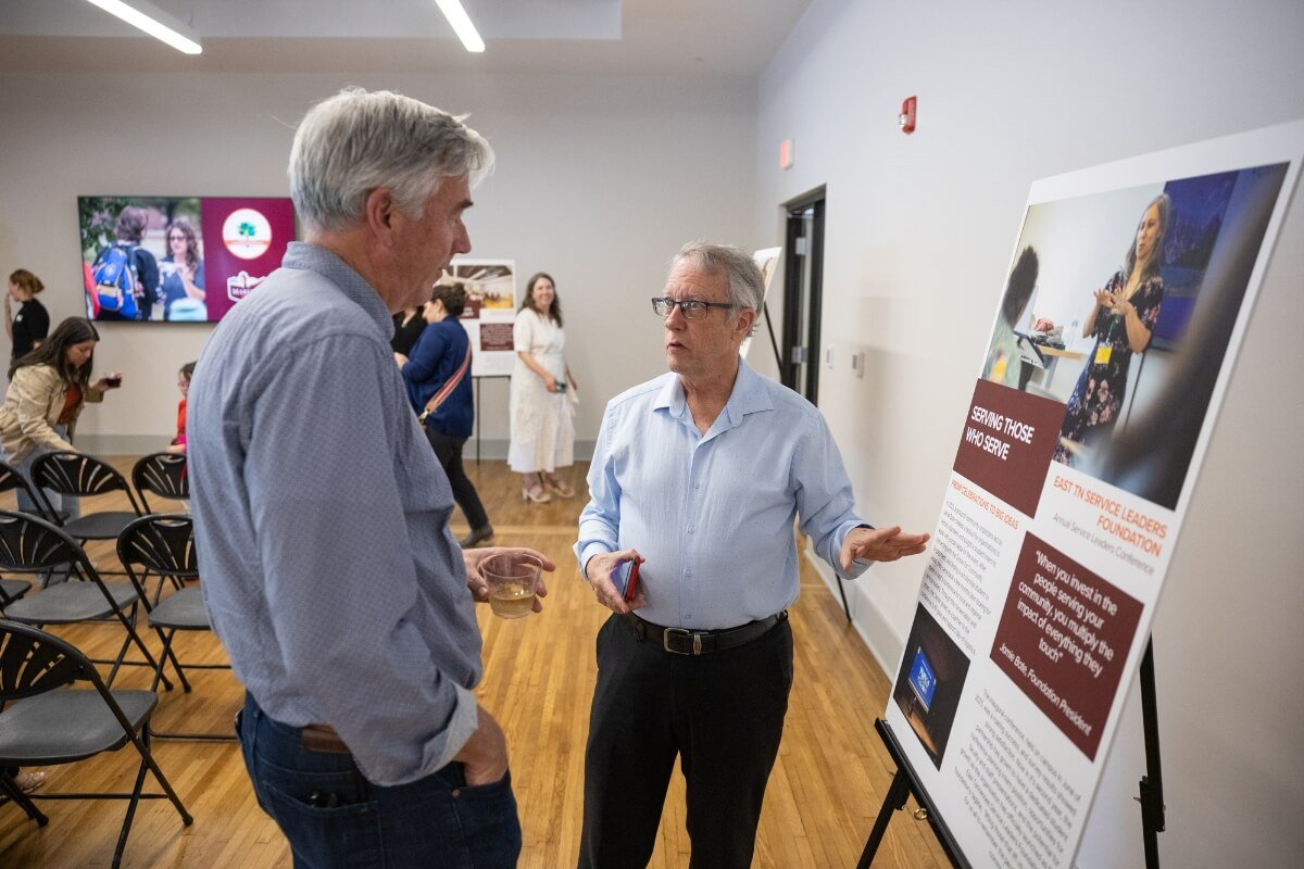 Photo of two men talking at the Maryville College Carnegie Classification celebration